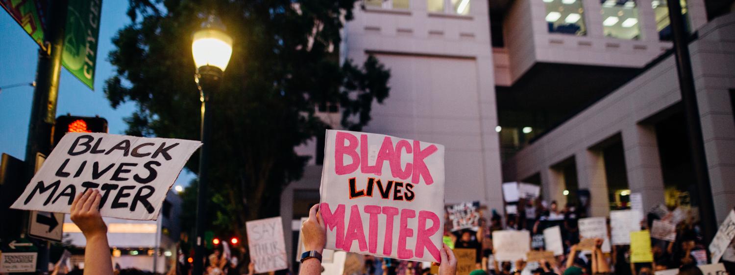 Protestors holding signs