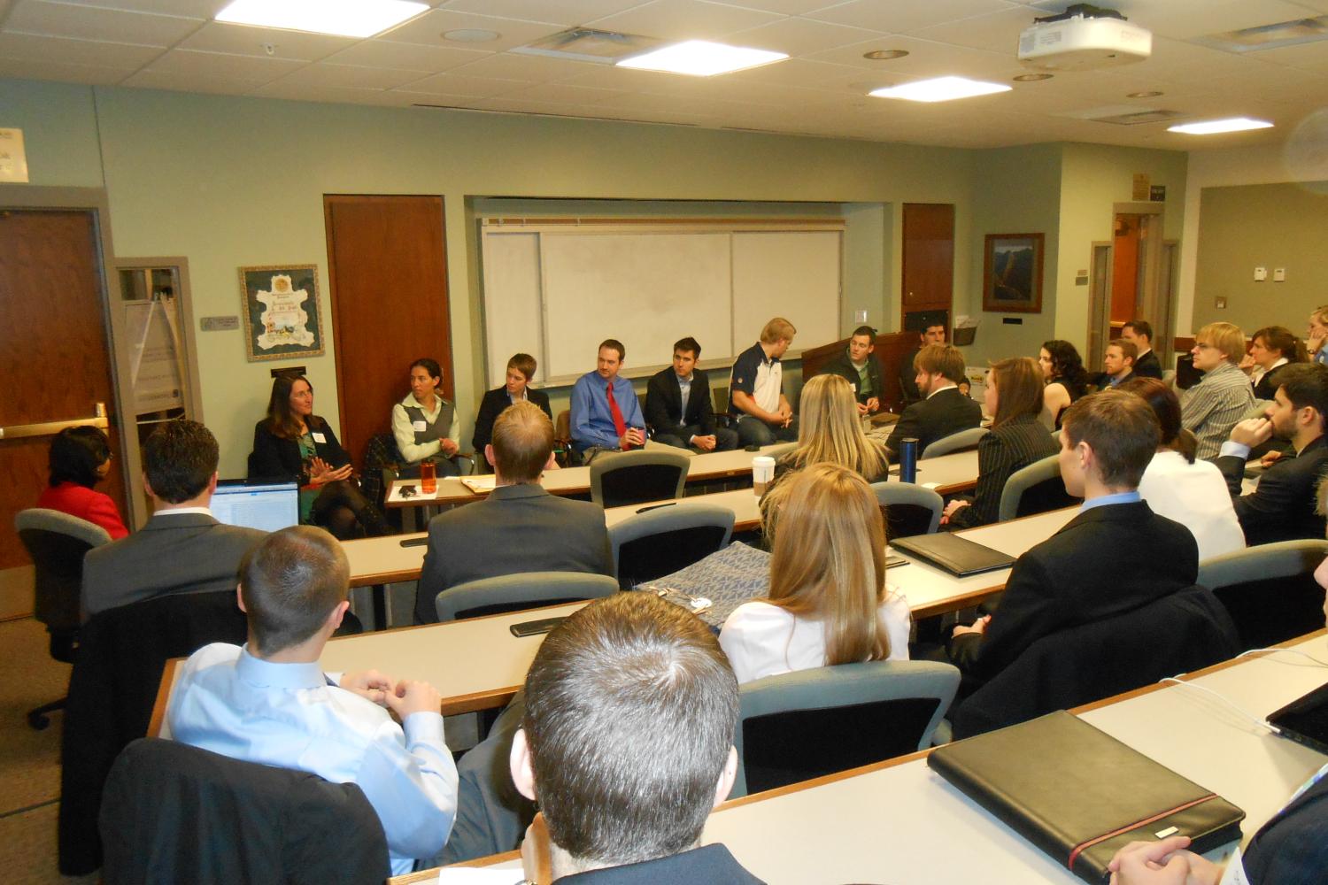 Julie Jacobs, Laura Streit, Julie Cuypers, Jens Jensen, Mike Warren, Adam Brown, Nate Goergen, and Mark Frantz speak at the 2L Summer Panel.