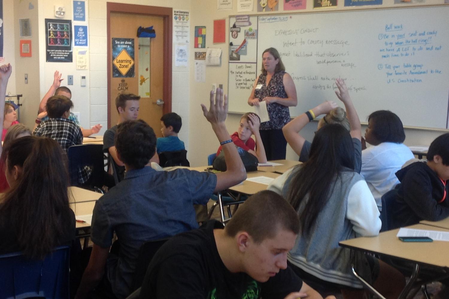 Students raising their hands