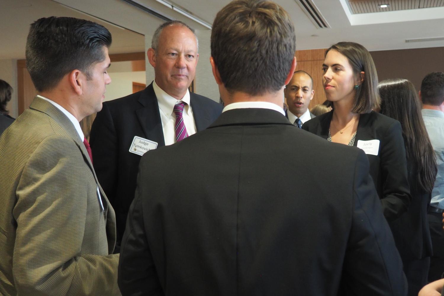 Judge Tymkovich chatting with students