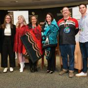 Professor Kristen Carpenter, Director of the American Indian Law Program, and student leaders from NALSA present Chief Justice Riley and Professor Malveaux with gift blankets. 