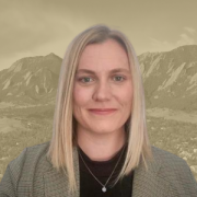 Headshot of Professor Christina Stanton on graphic background