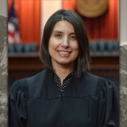 Headshot of Judge Kristy Martinez on graphic background