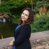 Headshot of Professor Kristelia García surrounded by greenery