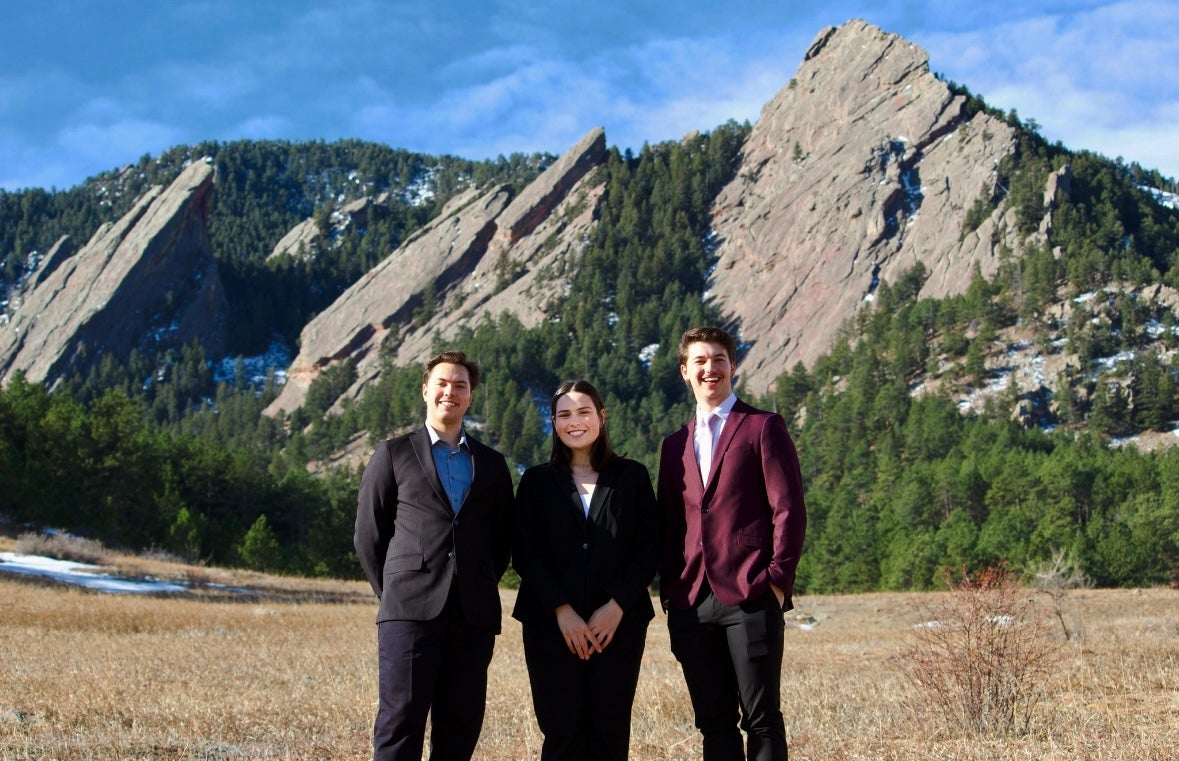 CUSG Tri-Executives posed in front of the Flatirons