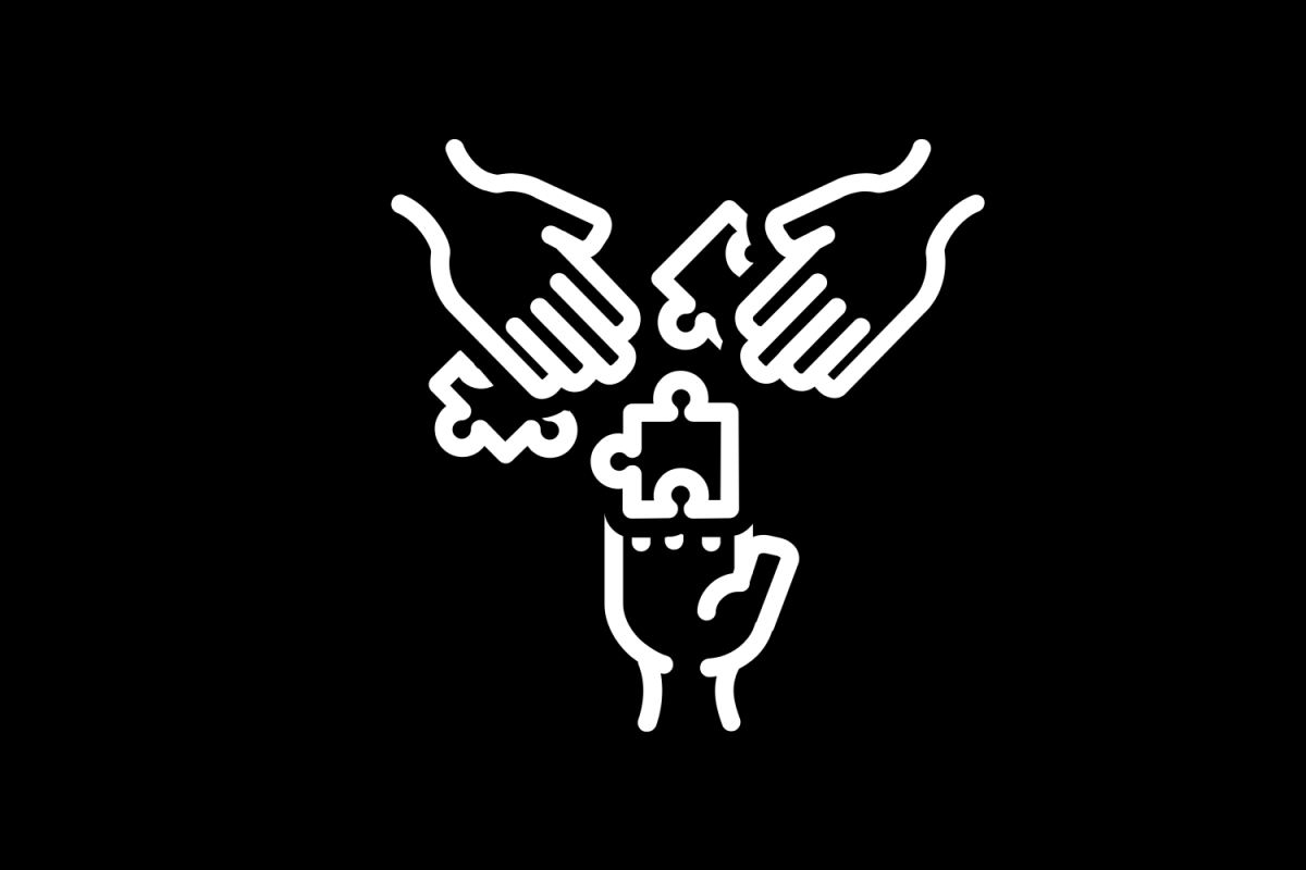Hand icons putting together a puzzle