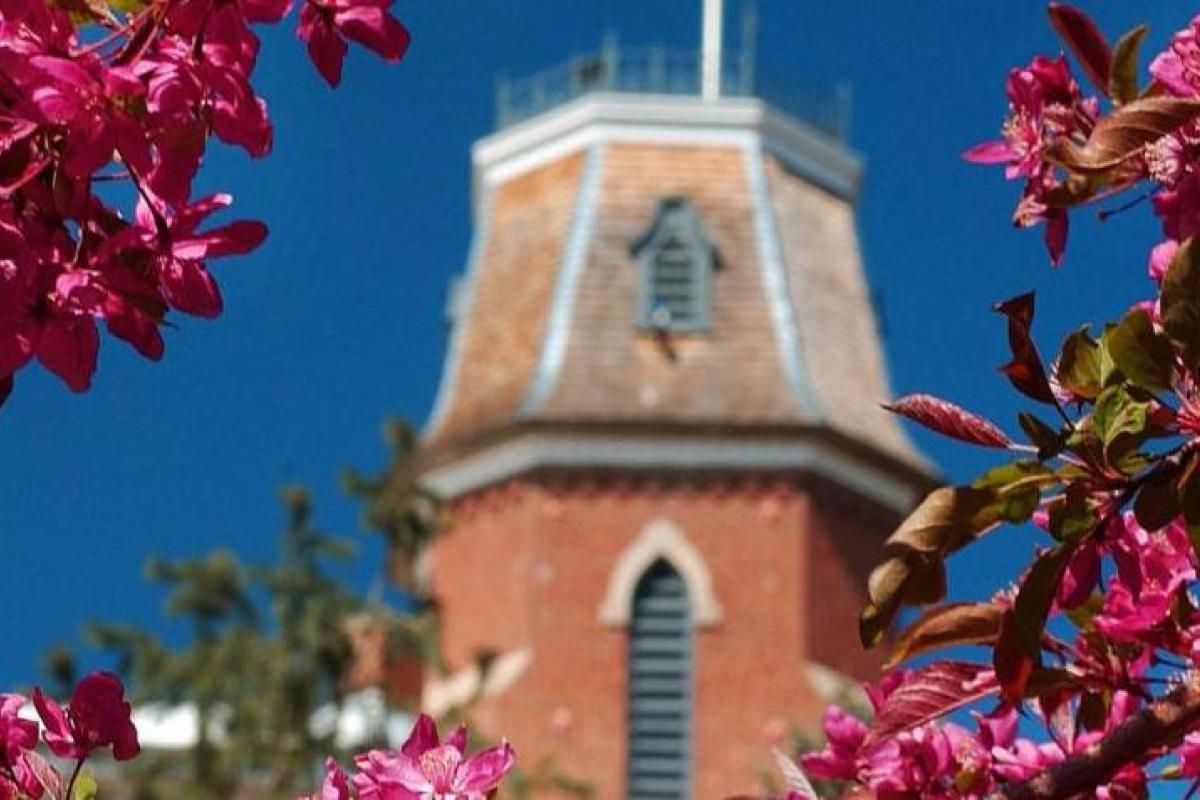 Old Main surrounded by flower blossoms
