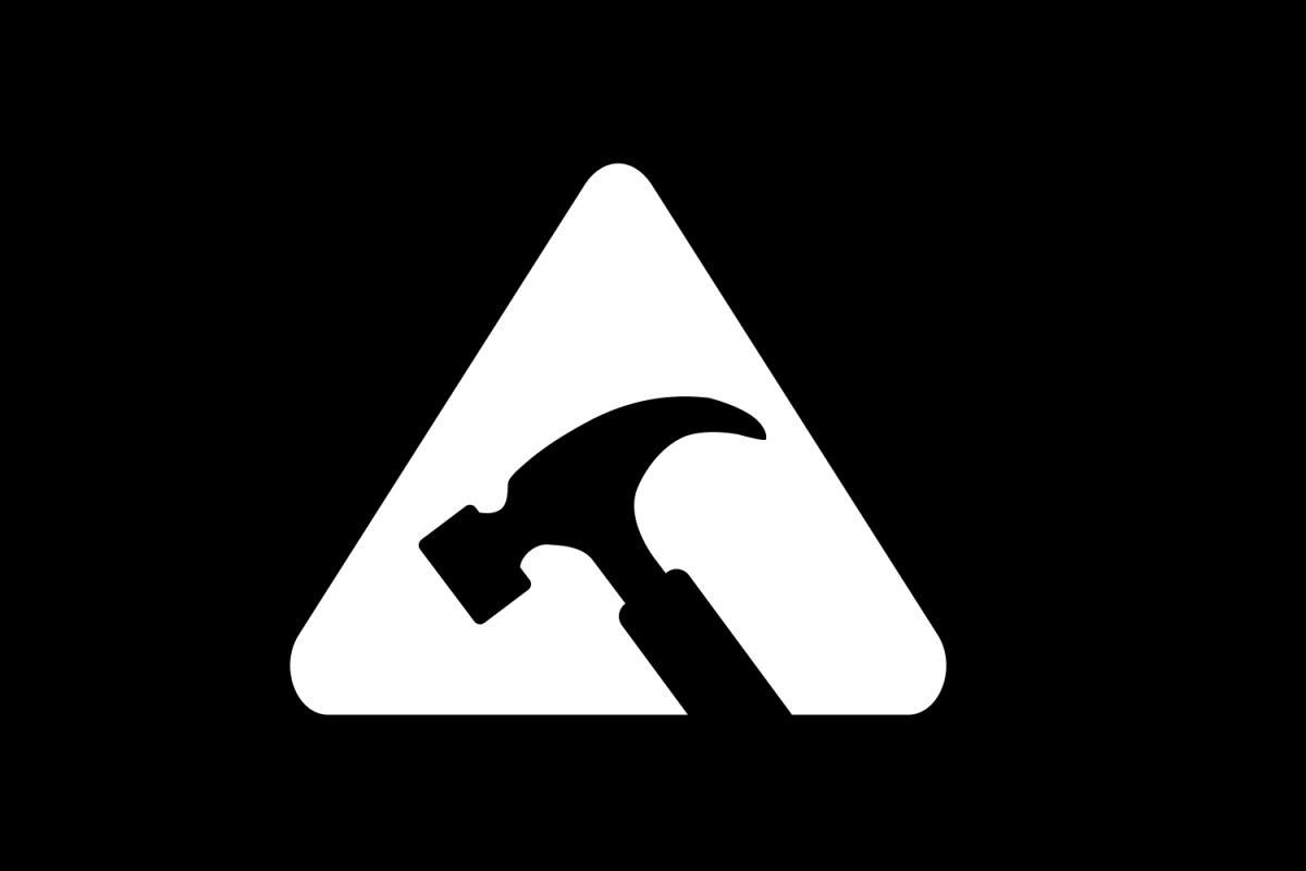 Yield sign with hammer in the middle icon