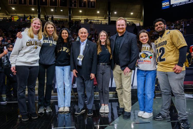 Graduating Leaders of the Year pose on the basketball court with Center for Leadership Staff