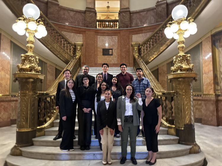MLS students pose on the staircase in the Colorado state capitol building