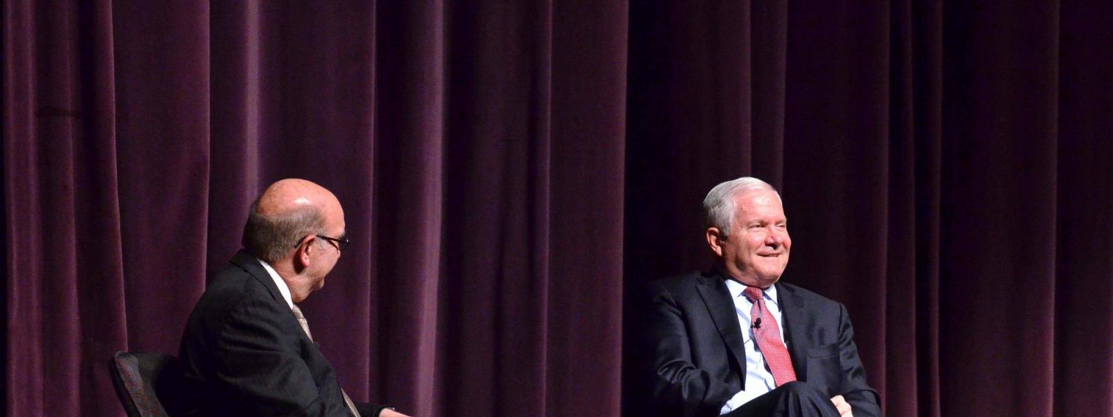 Dr. Robert Gates on stage with Chancellor Phil DiStefano