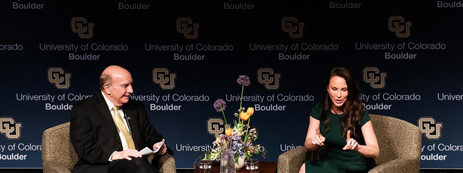 Molly Bloom on stage with Chancellor Phil DiStefano