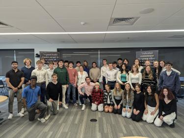 CU Boulder students pose around David Adelman and Stefanie Johnson