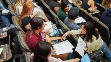 Students interacting in a lecture hall