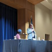 Boulder Mayor, Aaron Brocket, speaking on stage at CWA