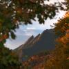 Flatiron peak surrounded by trees with fall colored leaves