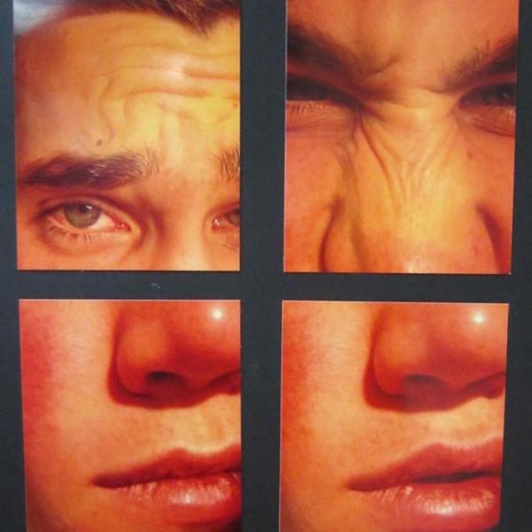 a collection of four pictures of a male face put together to create a portrait  