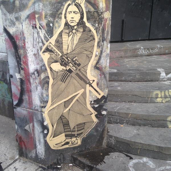 graffiti in New York City of a Native American in traditional dress