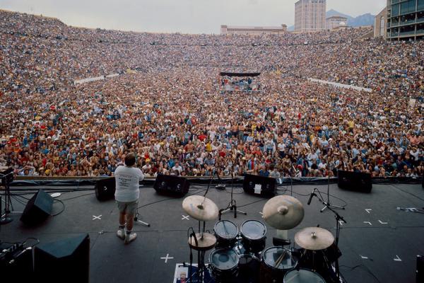 view of Folsom Field filled with a large crowd of people waiting for a music concert