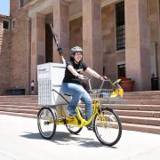 Megan Welsh on the library bike cart
