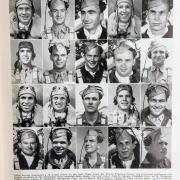 A photo taken of a page with photos of soldiers.