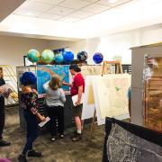 Boulder Prep students work with a map librarian.