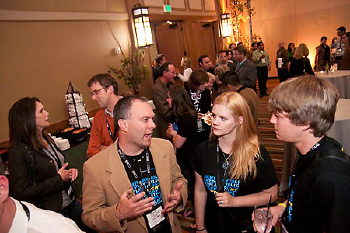 A group talks at a conference.