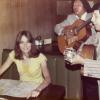 Dr. Palmer being serenaded by 2 guitar players