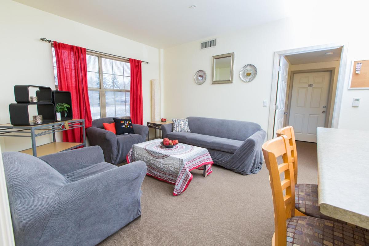 Bear Creek living room with sofa, chairs, coffee and side tables, window