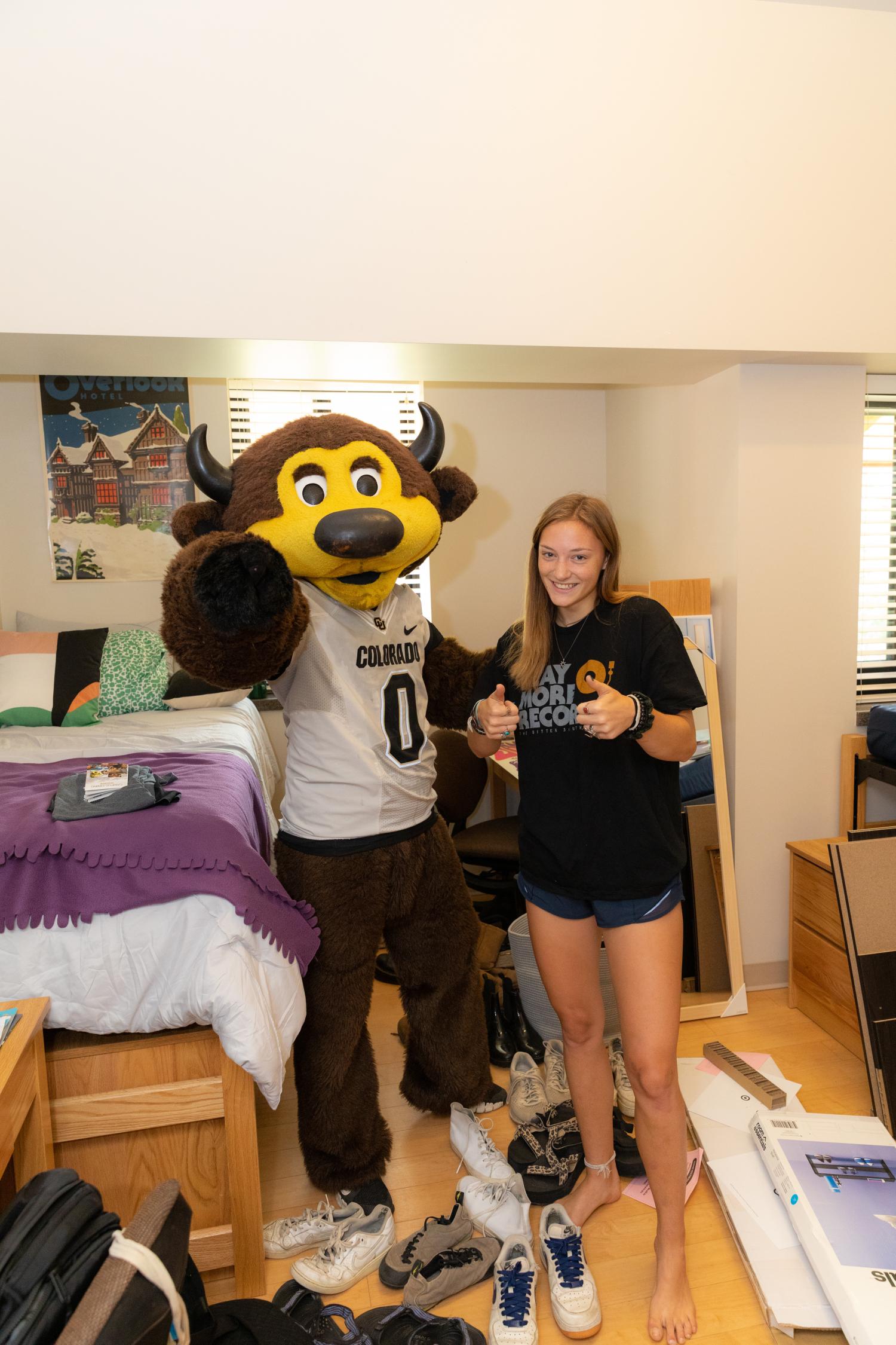Chip and student standing in a res hall
