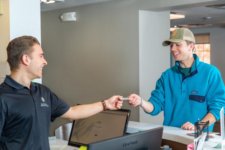 Student and staff interacting