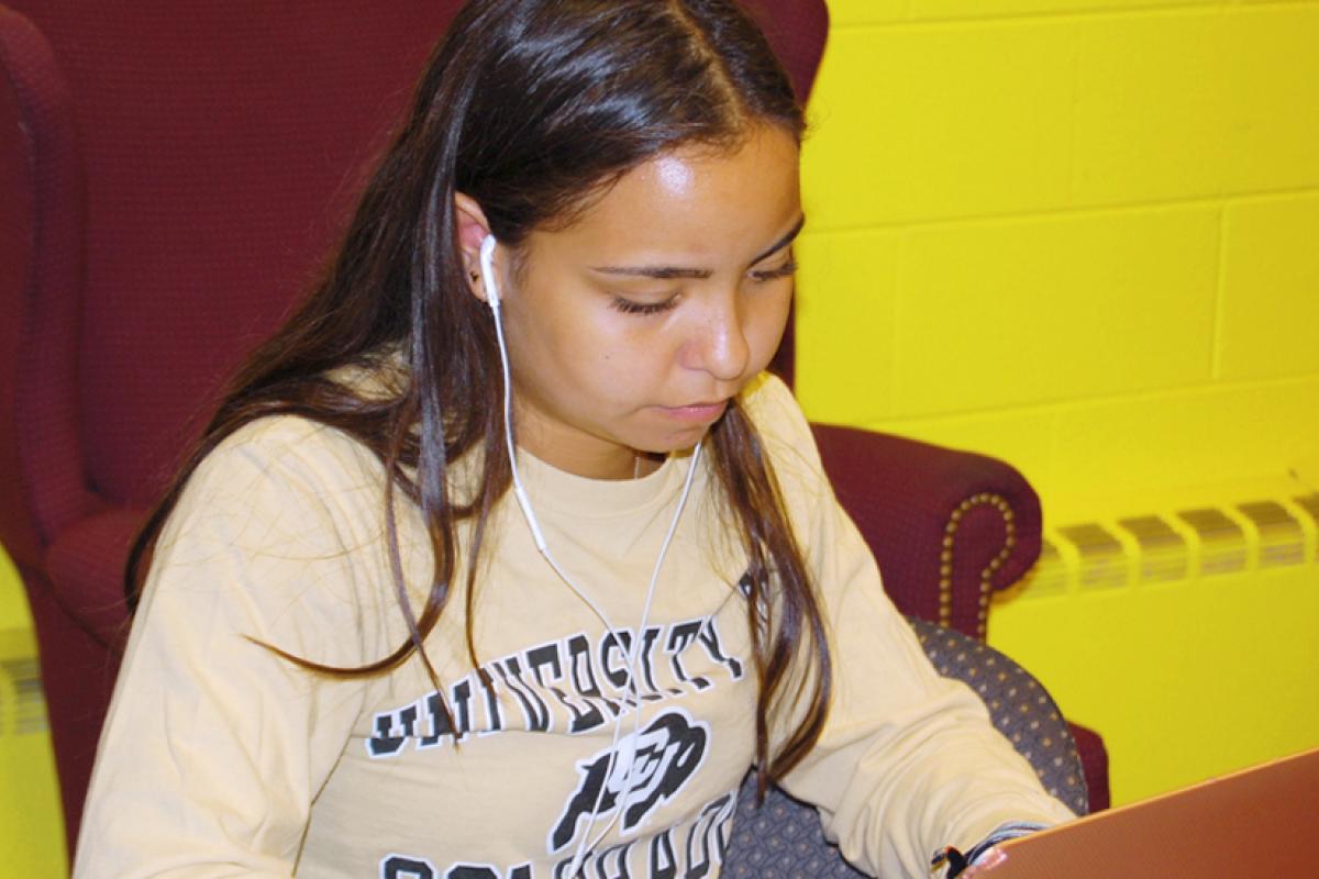 MASP student studying on her laptop