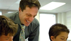 Professor Eric Stade with students at Lafayette's Pioneer Elementary