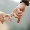 Couple holding hands.