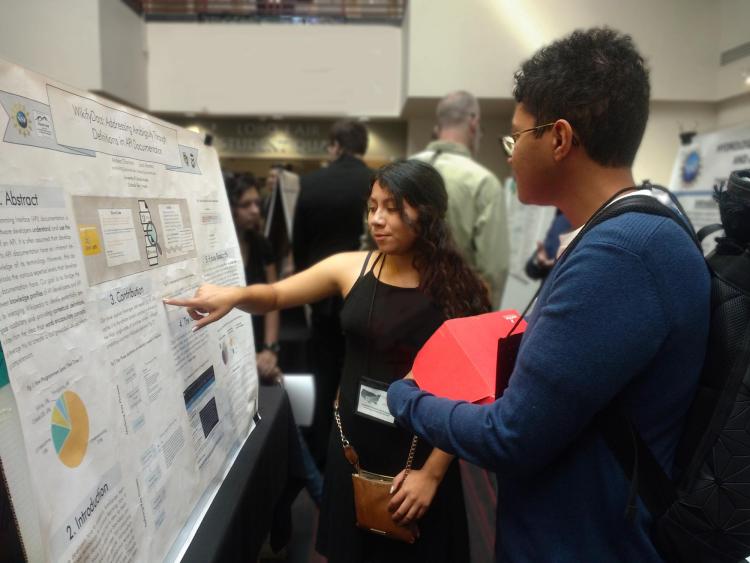 Andrea Chamorro presents a research poster