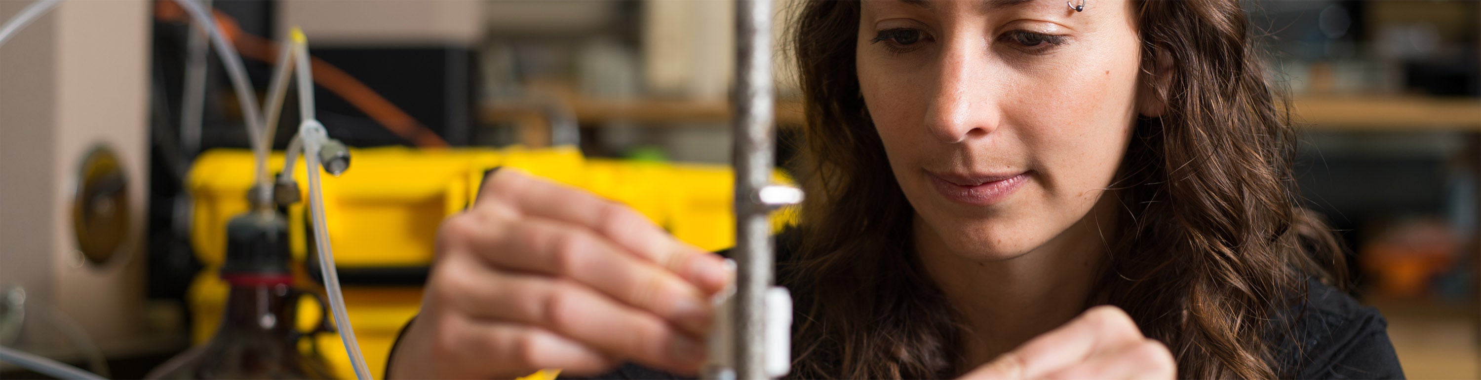 A student works on air quality research equipment.