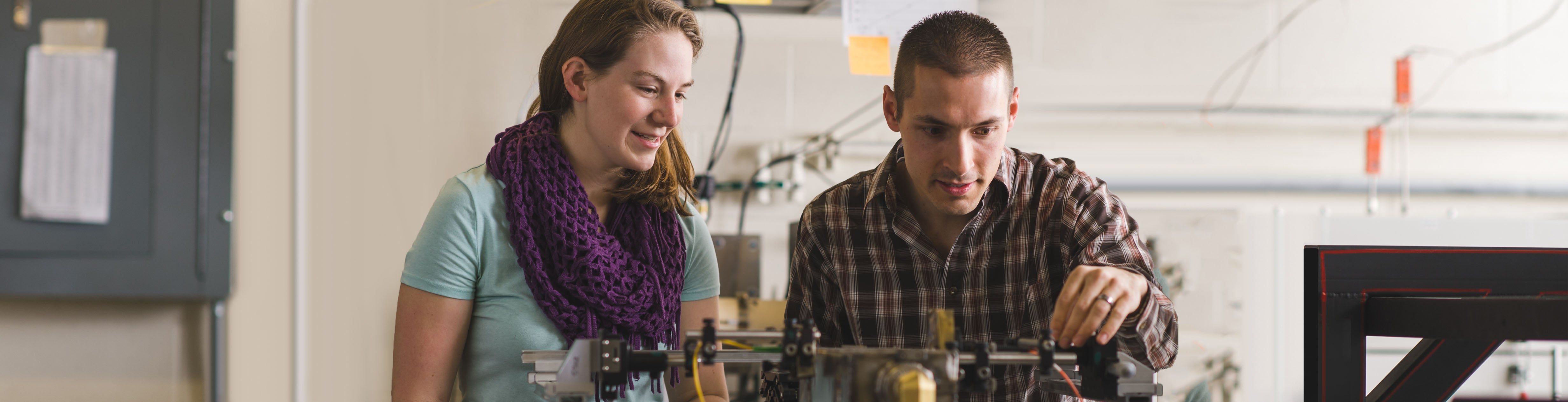 Two students in professor Greg Rieker's lab.