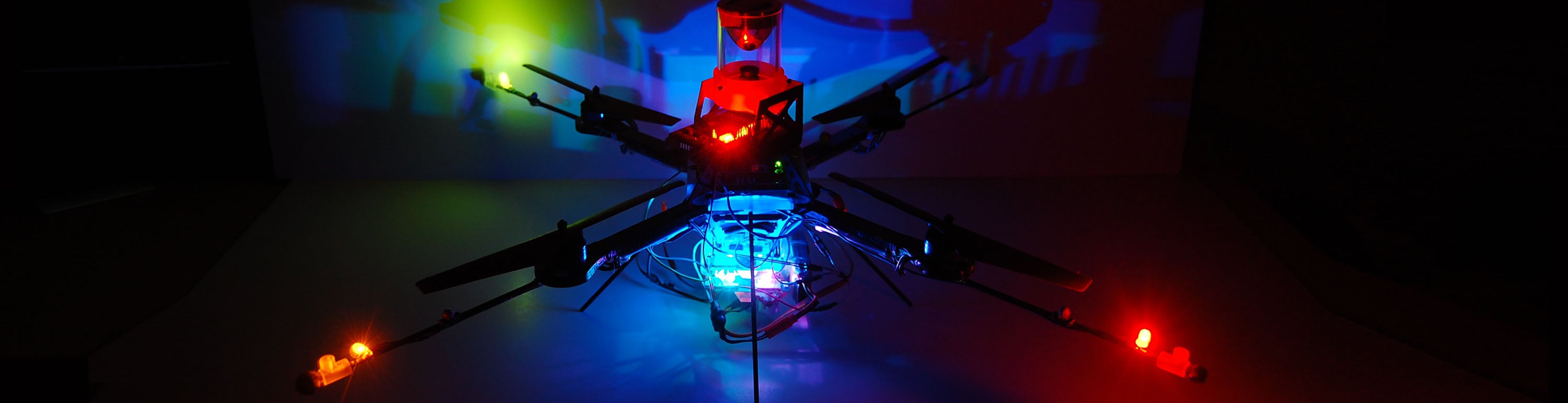 An unmanned aerial vehicle with colored lights.