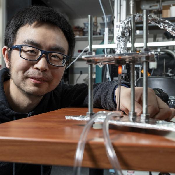 Longji Cui posing with his zero gap TPV device