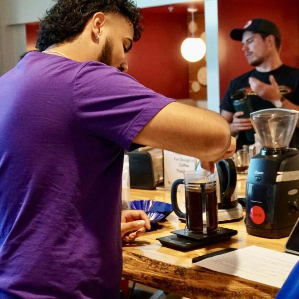 Jose Soto brews coffee with french press