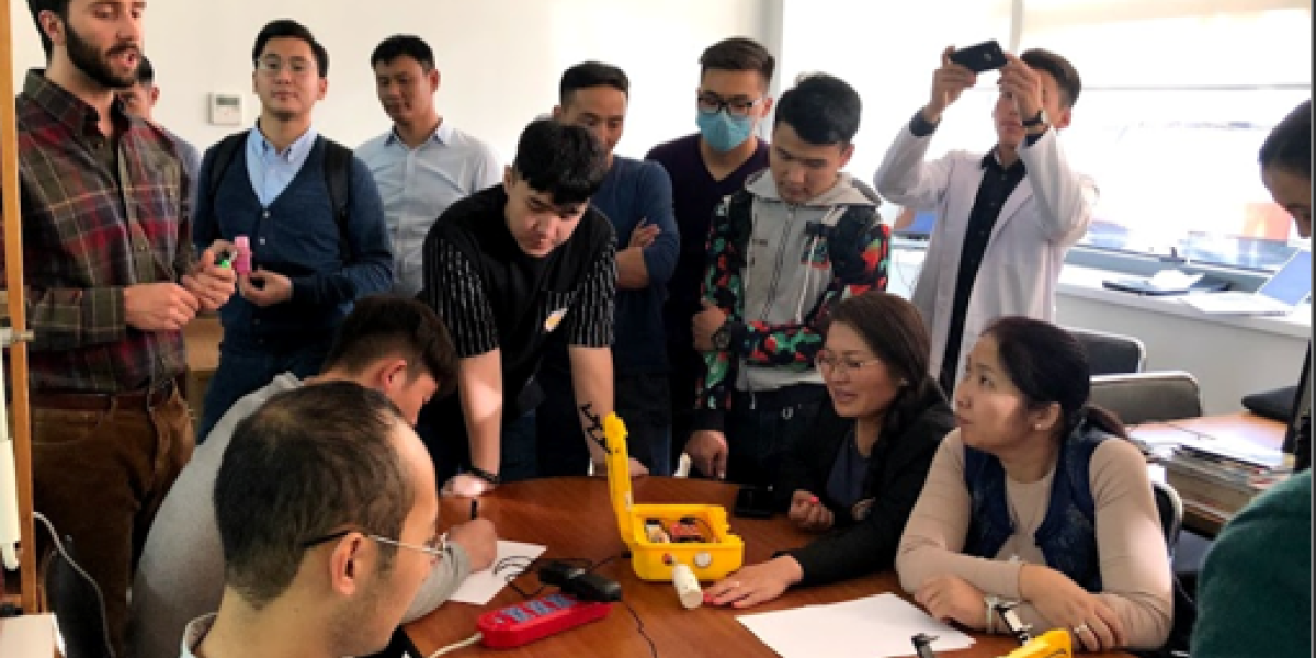 Group of people around a table for Public Lab Mongolia