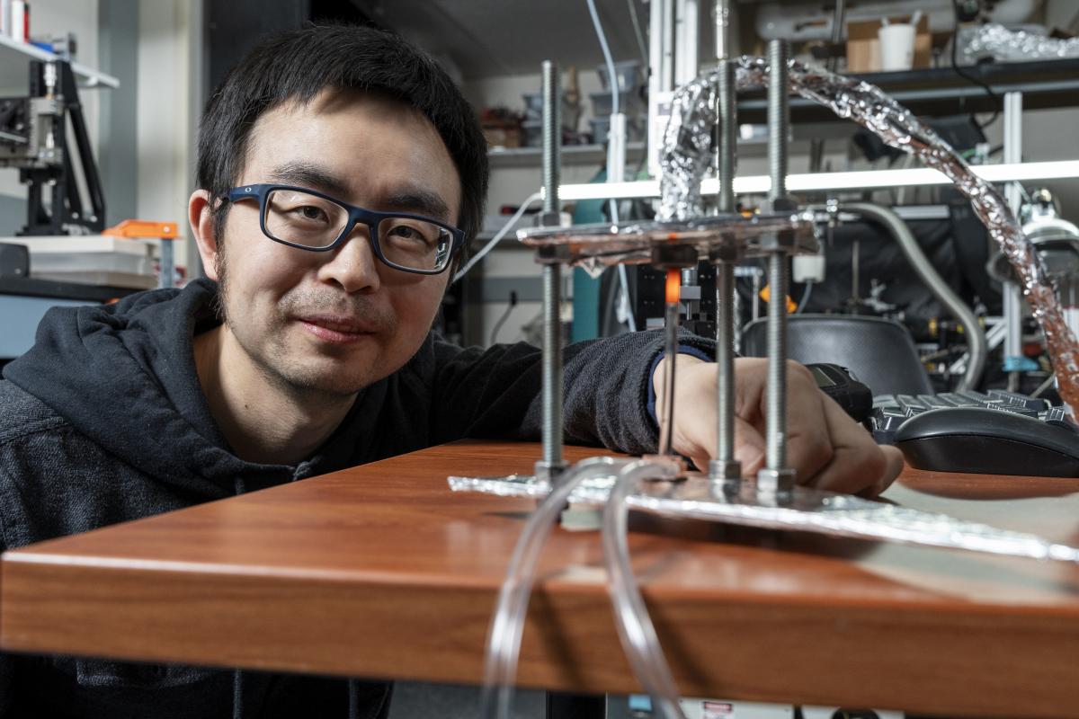 Longji Cui posing with his zero gap TPV device