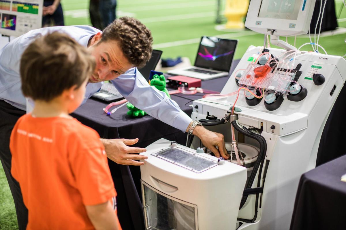 Teaching child at Engineering Projects Expo 2019