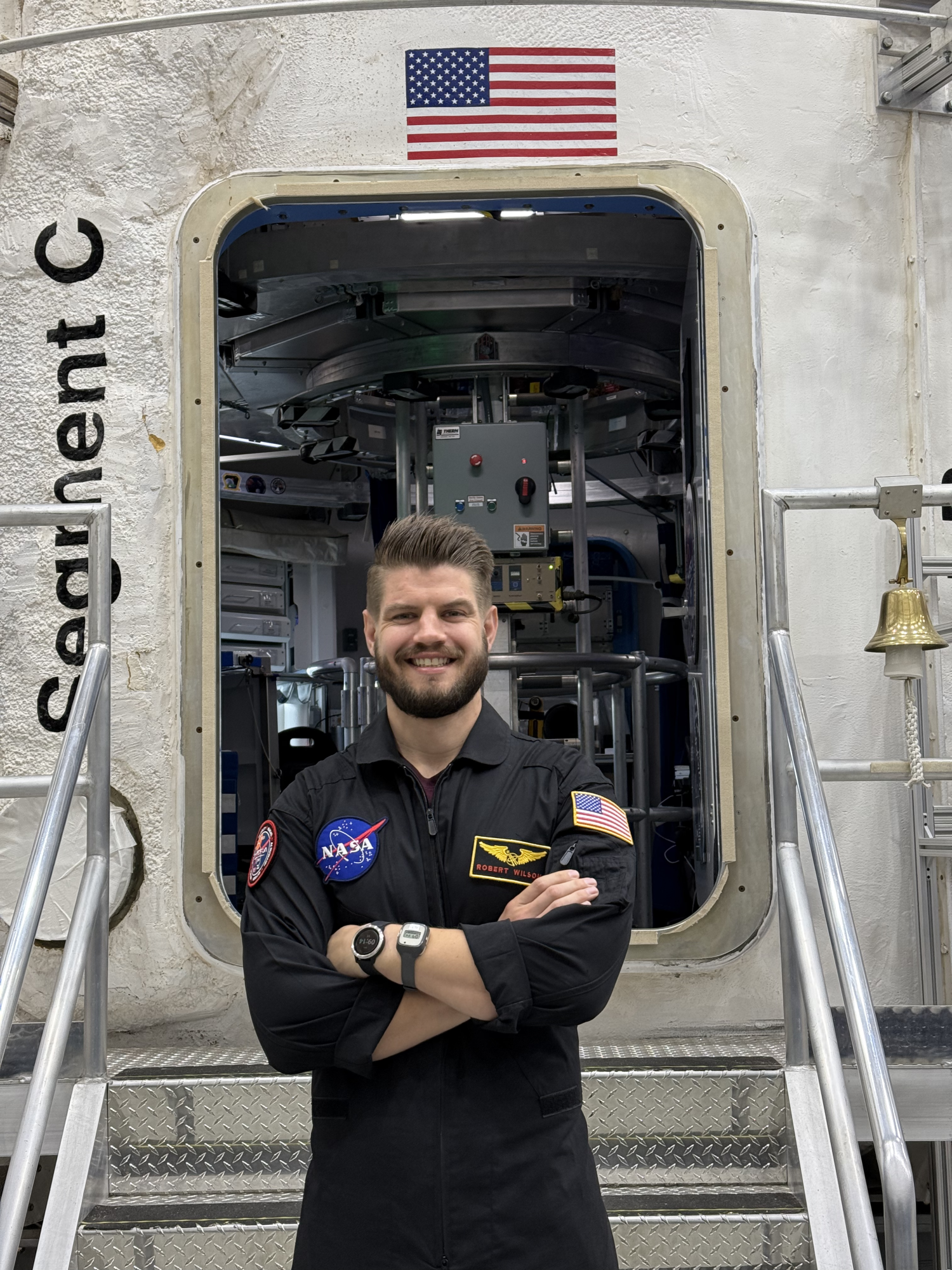 Robert Wilson standing in front of the HERA facility in Houston