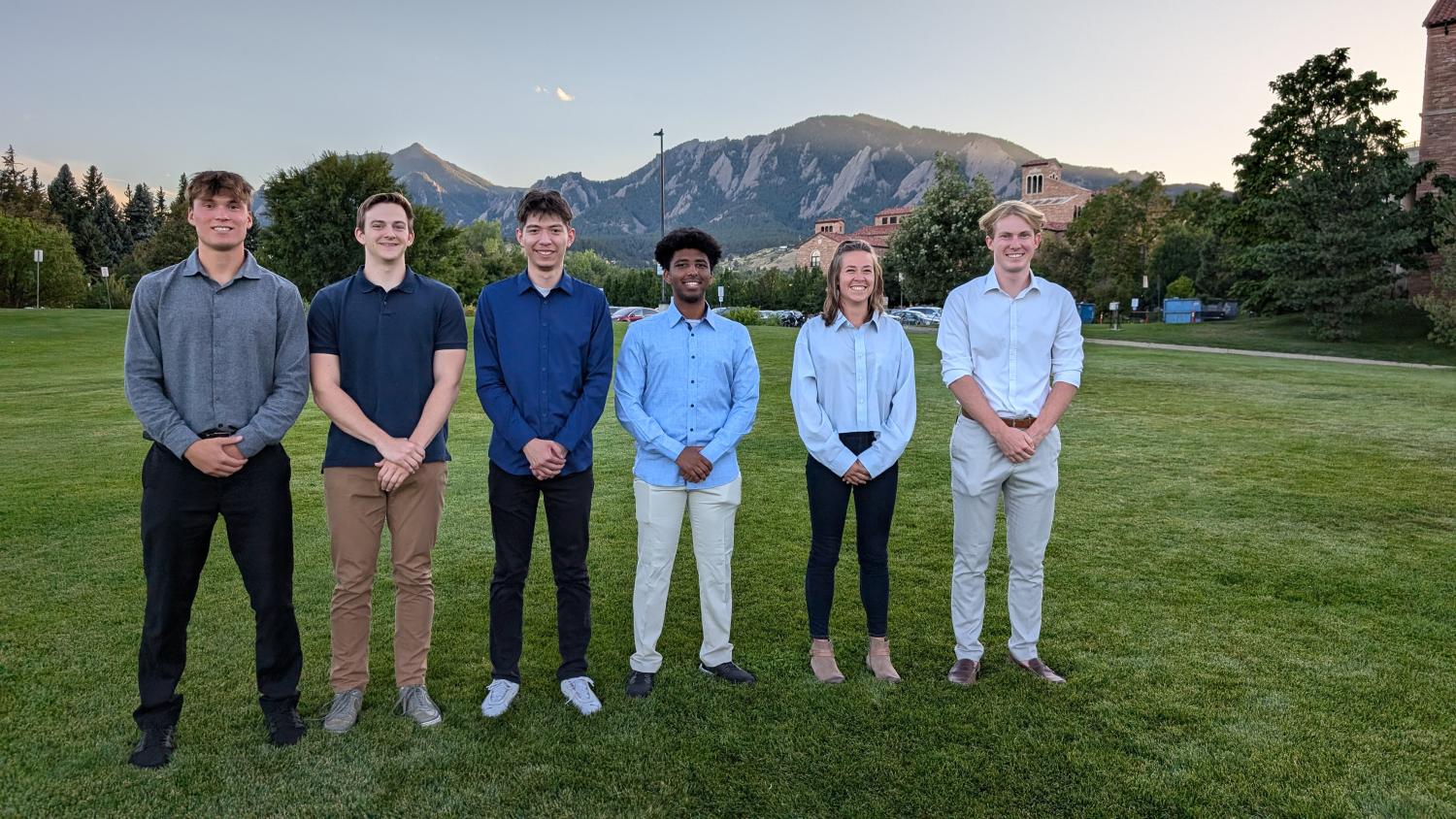 students posing for group photo outside