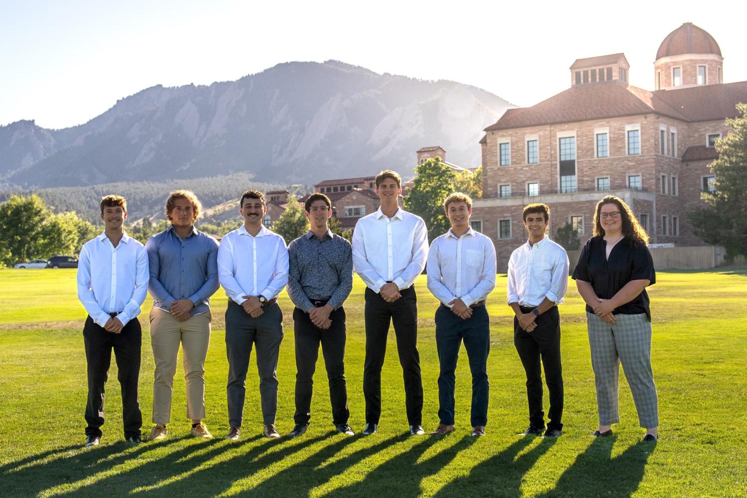 students posing for group photo outside