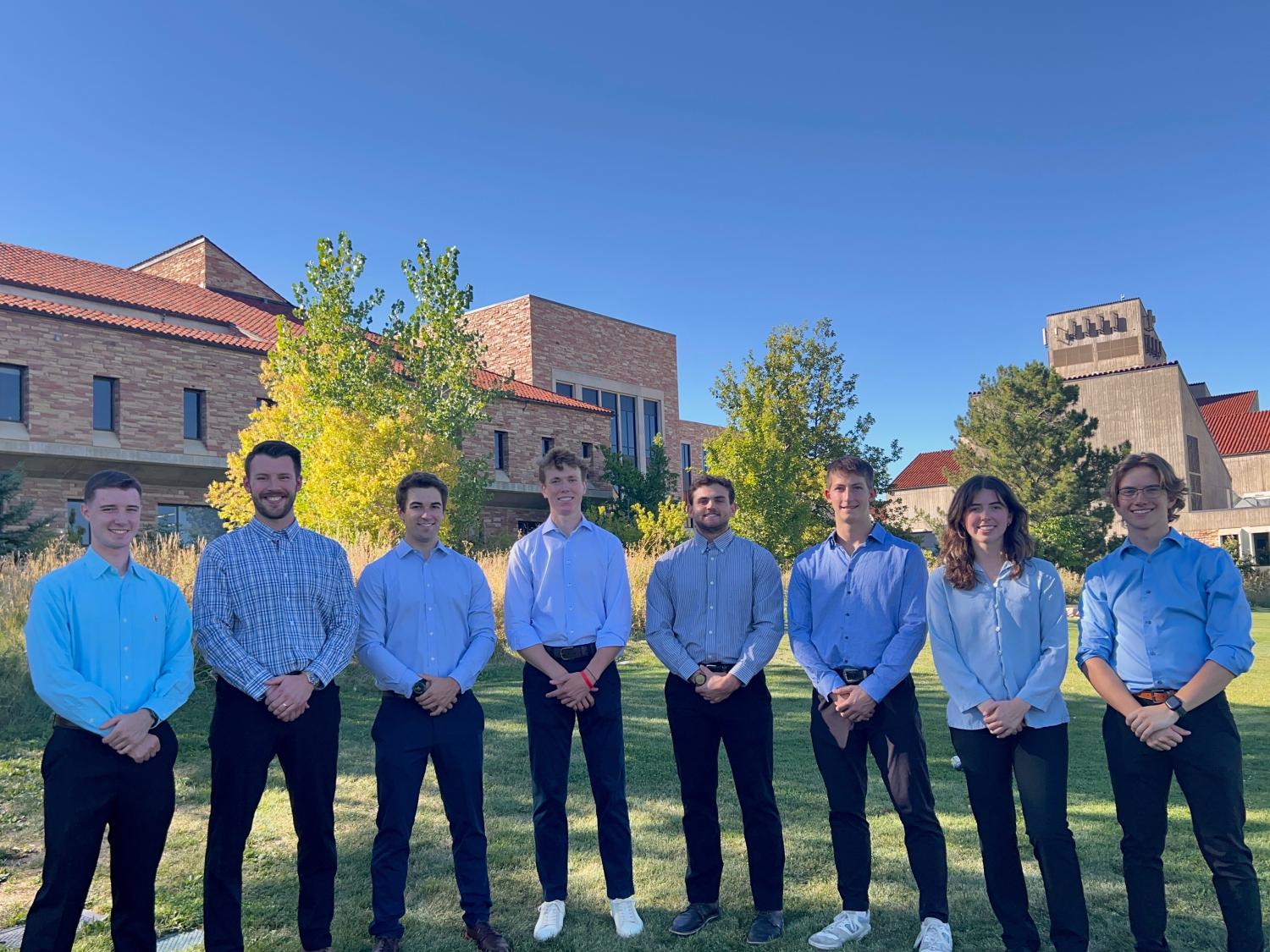 students posing for group photo outside