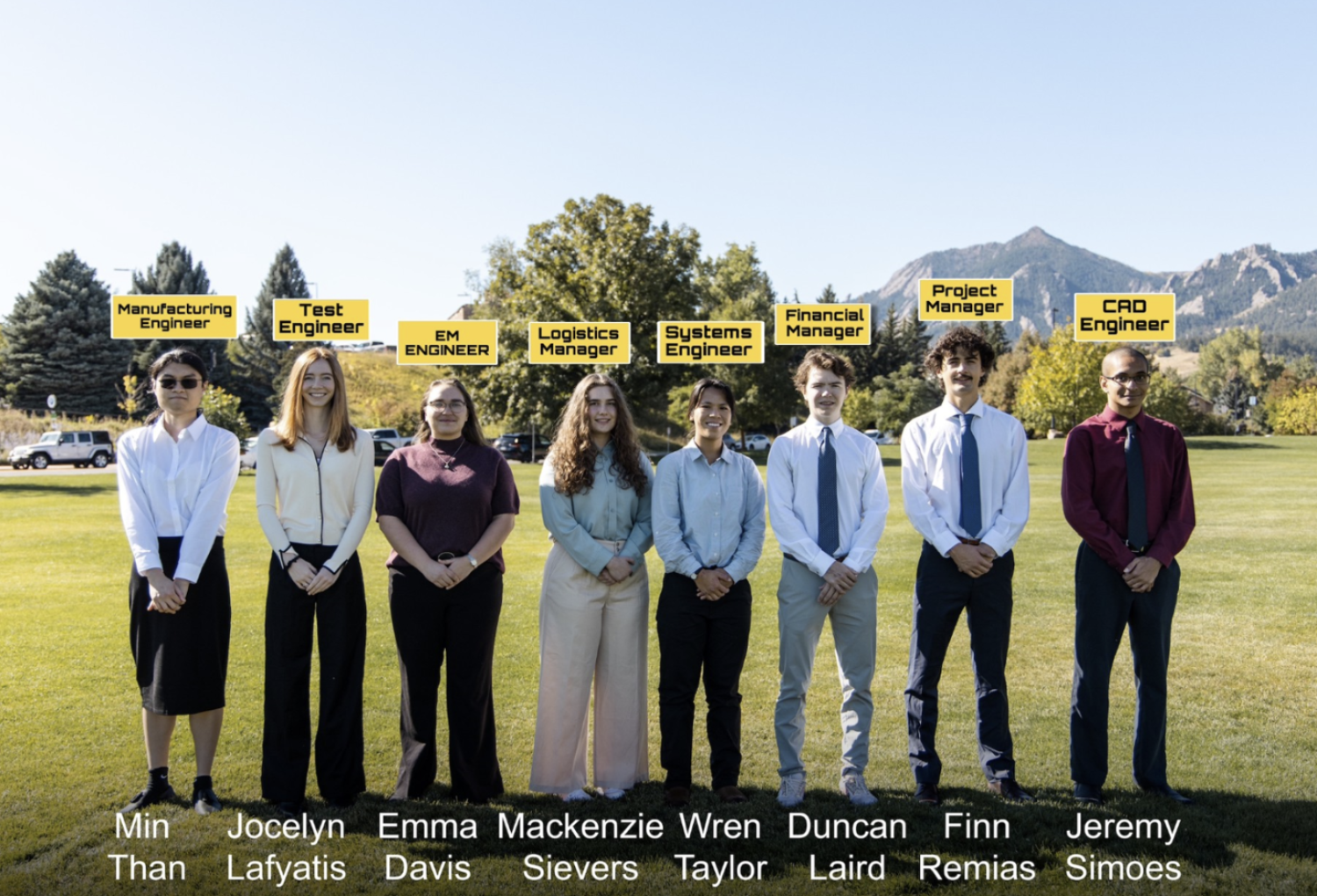students posing for group photo outside