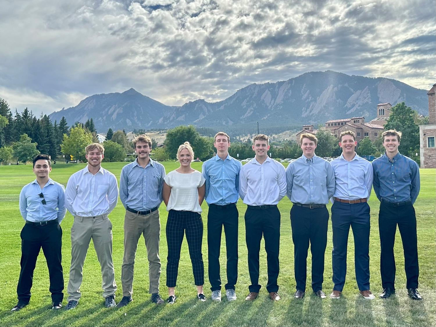 students posing for group photo outside