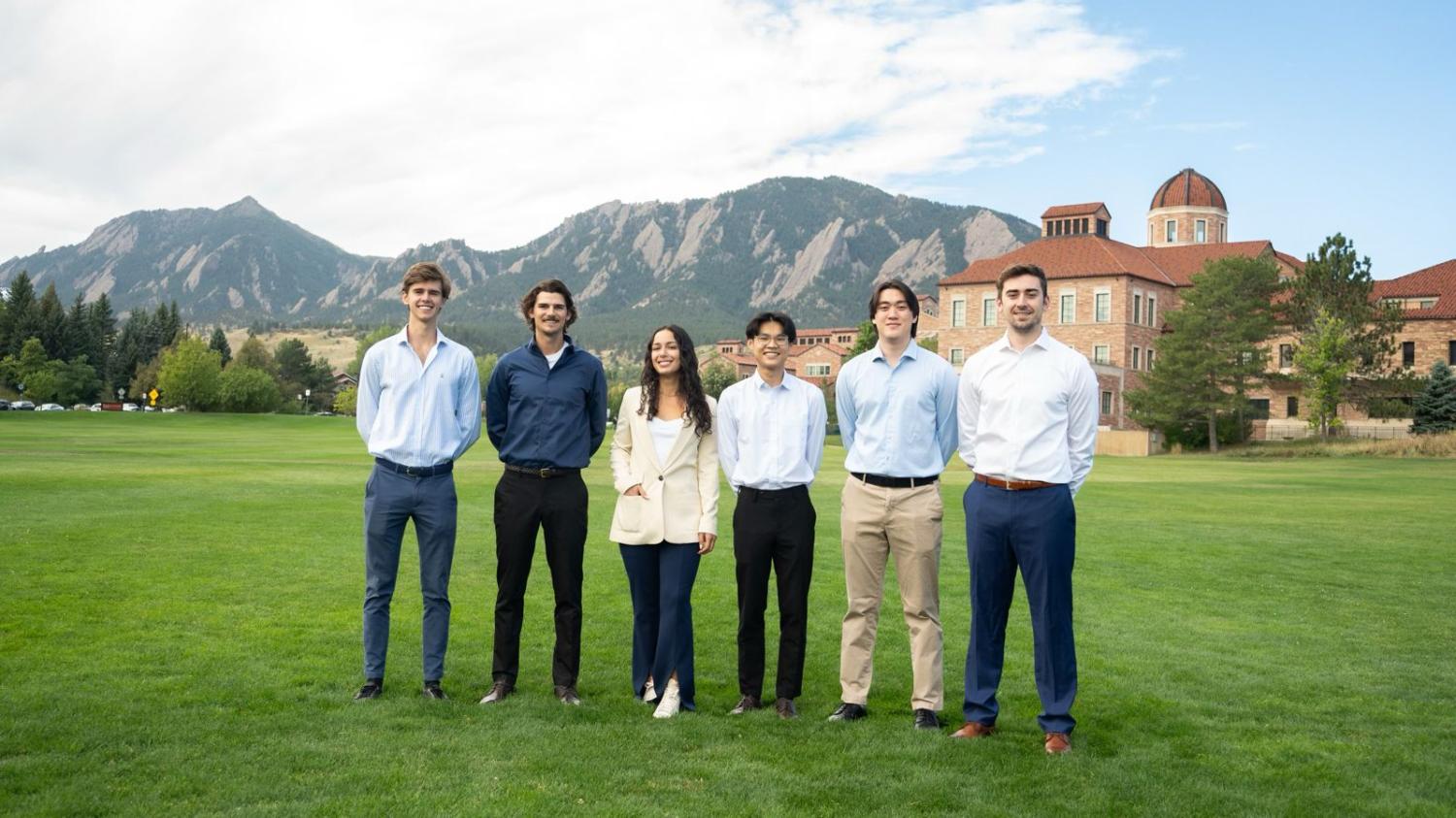 students posing for group photo outside